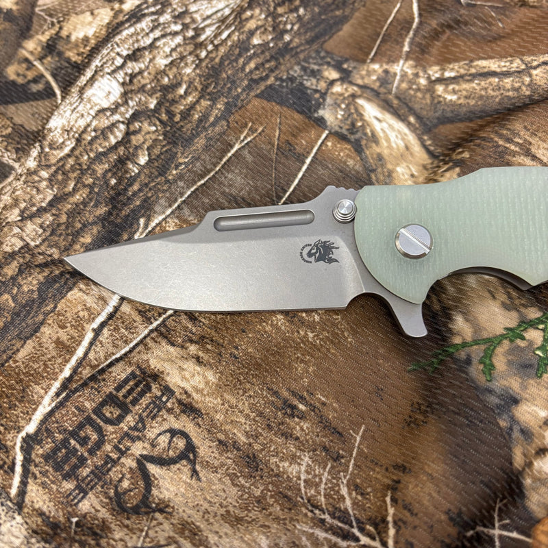 Load image into Gallery viewer, Rick Hinderer Jurassic Frontier 3.375" Magnacut Clip Point, Tri-Way, Working Finish, Translucent Green G10 Knife
