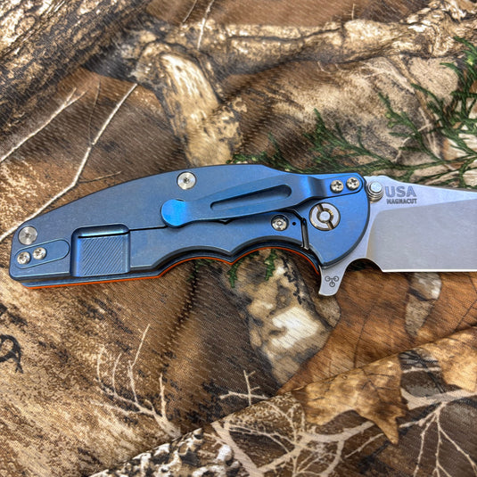 Rick Hinderer Jurassic 3.375" Magnacut Slicer, Hollow Grind, Tri-Way, Stonewash Blue, Orange G10 Knife