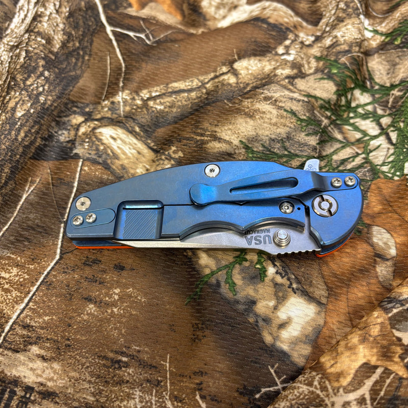 Load image into Gallery viewer, Rick Hinderer Jurassic 3.375" Magnacut Slicer, Hollow Grind, Tri-Way, Stonewash Blue, Orange G10 Knife
