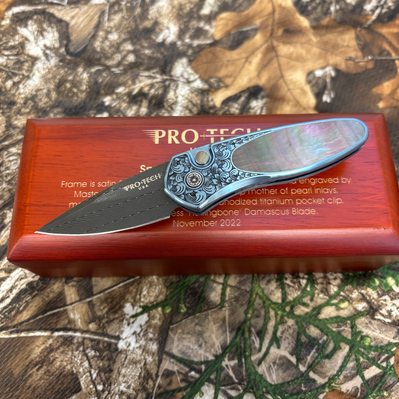 Load image into Gallery viewer, Protech 2022 Sprint Custom 002 2" Blue Anodized Titanium Frame Engraved by Bruce Shaw, Vegas Forge Damascus Blade, Pearl Button, Pearl Inlay, Titanium Clip Automatic Knife
