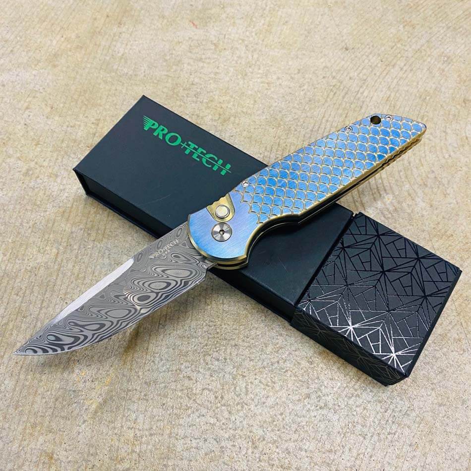 PROTECH 2023 TR-3 Custom 001 Tactical Response 3 Damasteel with Mike Irie Compound Ground Blade, Titanium Fish Scale 2 Tone Bronze Chamfers with Orange Peel Blue Flats, Pearl Button, Automatic Knife