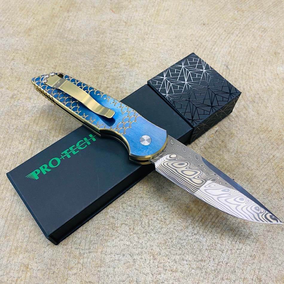 PROTECH 2023 TR-3 Custom 001 Tactical Response 3 Damasteel with Mike Irie Compound Ground Blade, Titanium Fish Scale 2 Tone Bronze Chamfers with Orange Peel Blue Flats, Pearl Button, Automatic Knife - 2023 TR-3 Custom 001